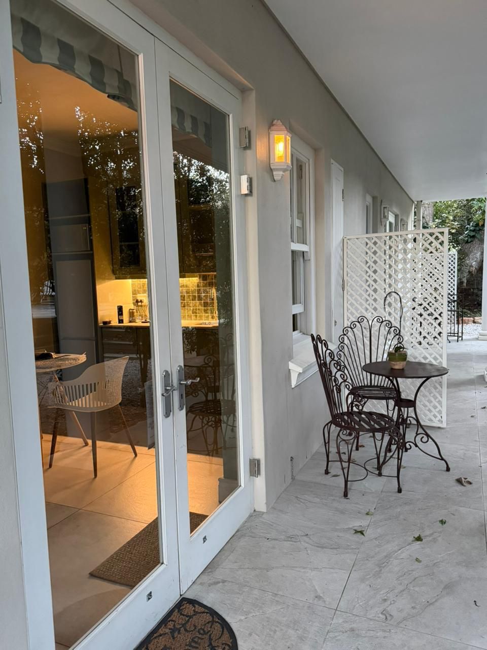 Private patio with French doors and seating